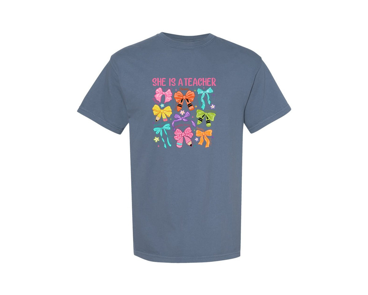 brand:Comfort Colors|color:Blue Jean|She Is A Teacher Bow Crayon Graphic T-Shirt