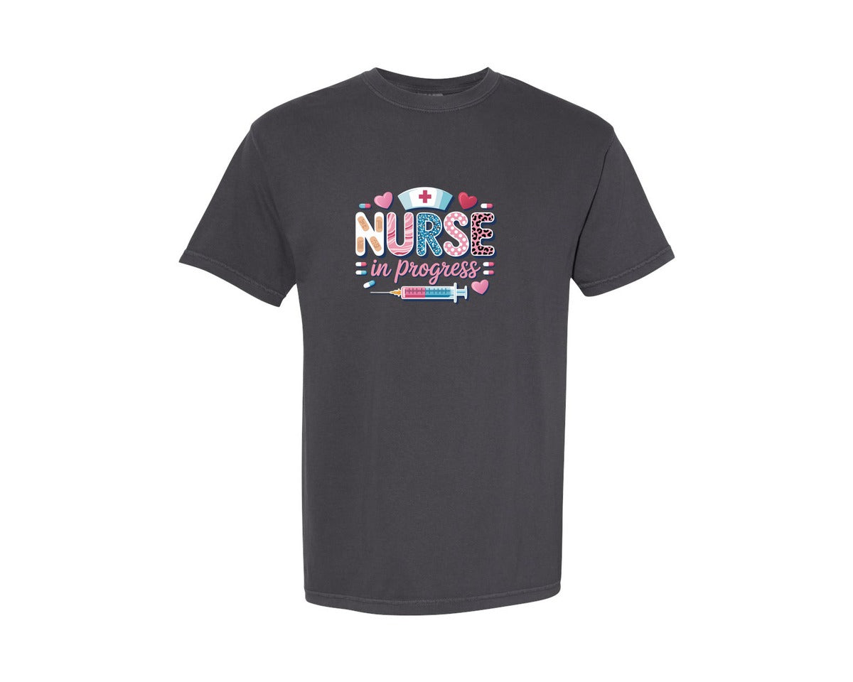 brand:Comfort Colors|color:Graphite|Nurse In Progress Medical Themed Design Graphic T-Shirt