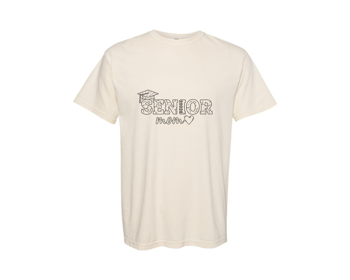 brand:Comfort Colors|color:Ivory|Cracked Senior Mom 2026 Outline Graphic T-Shirt