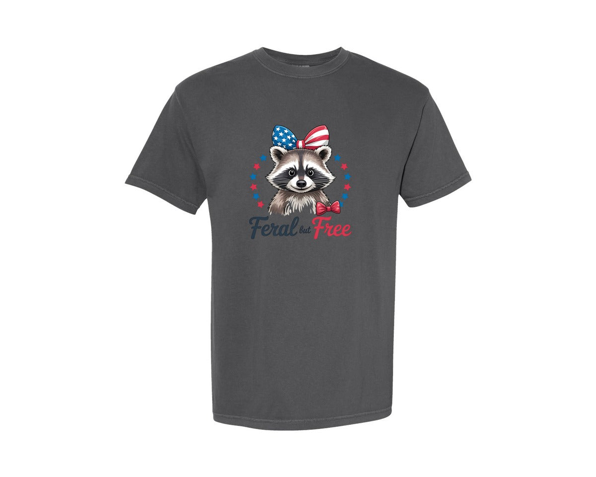 brand:Comfort Colors|color:Pepper|Feral But Free Raccoon Patriotic Graphic T-Shirt
