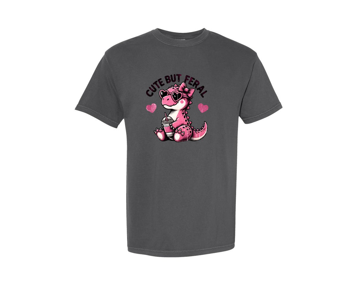 brand:Comfort Colors|color:Pepper|Cute But Feral Baby Girl Dinosaur Graphic T-Shirt