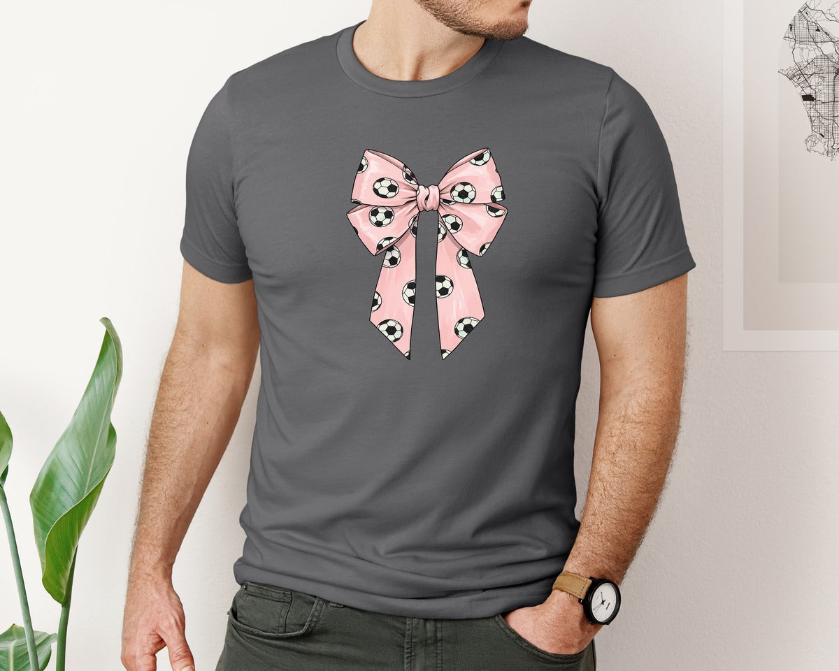 brand:Bella Canvas|color:Asphalt|Soccer Pattern Coquette Bow Graphic T-Shirt