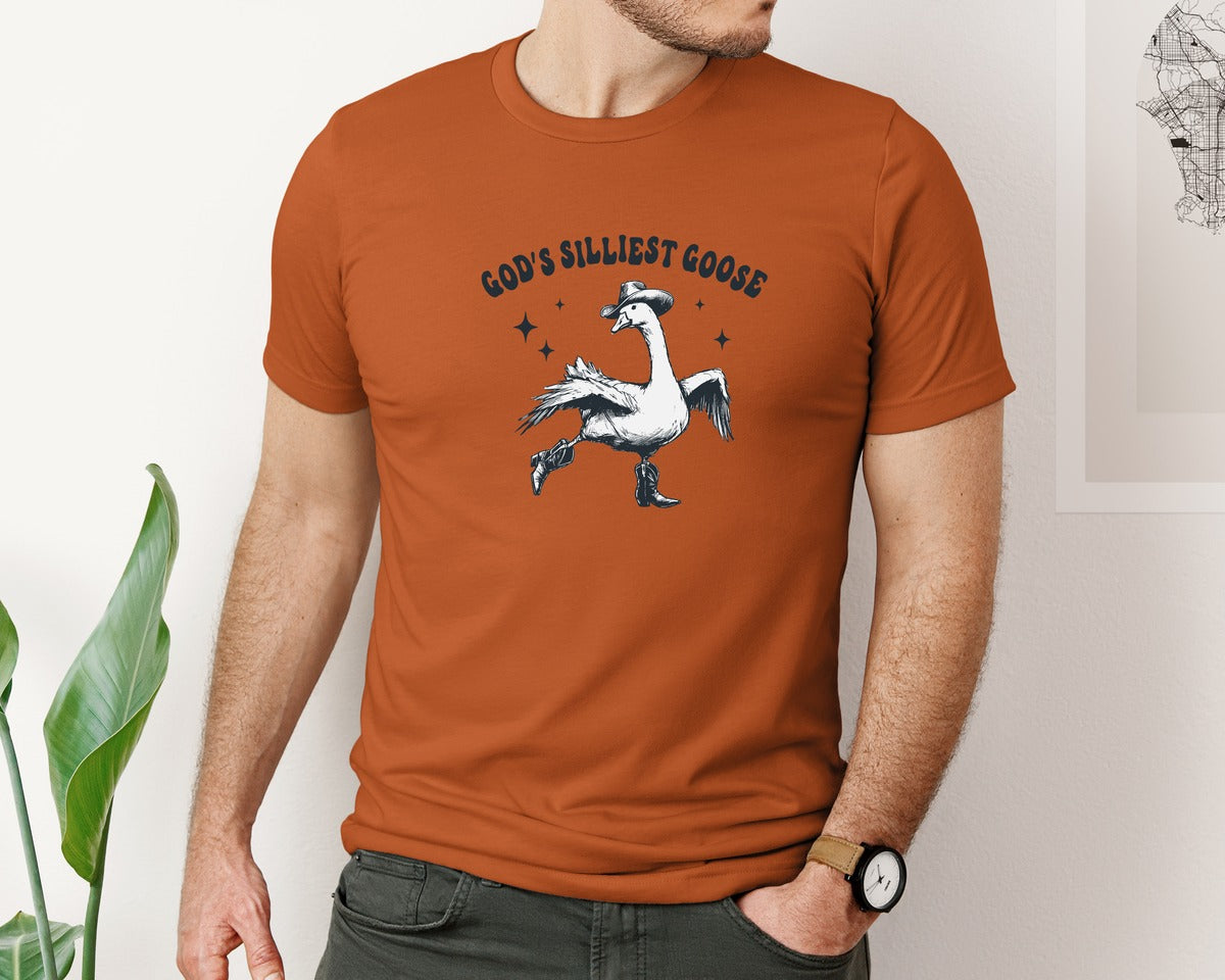brand:Bella Canvas|color:Autumn|Gods Silliest Cowboy Goose Dancing Shir Graphic T-Shirt