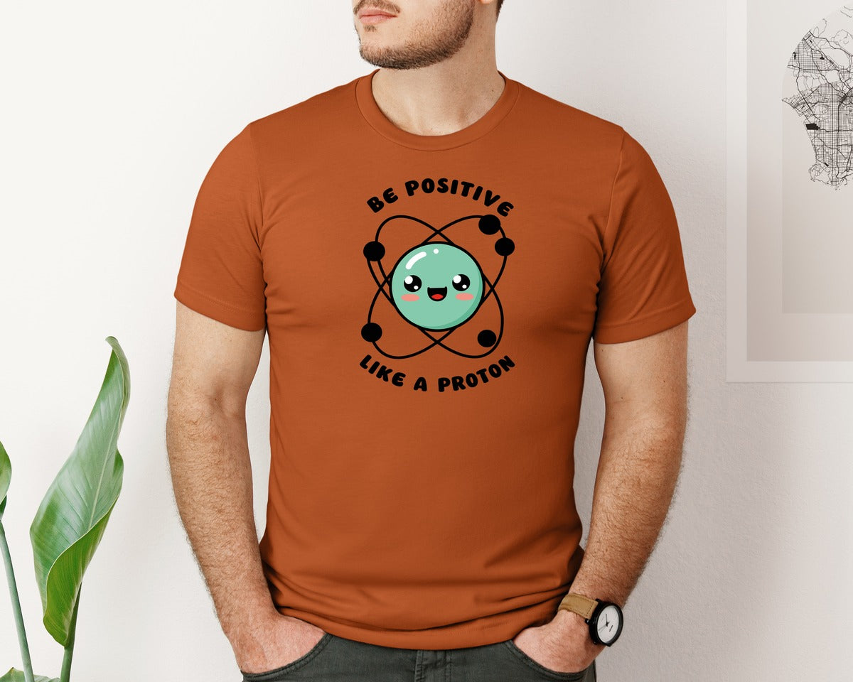 brand:Bella Canvas|color:Autumn|Be Positive Like A Proton Graphic T-Shirt