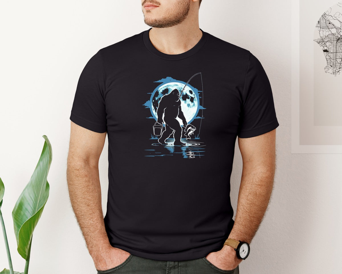 brand:Bella Canvas|color:Black|Bigfoot Fishing In Moonlight Sasquatch Graphic T-Shirt