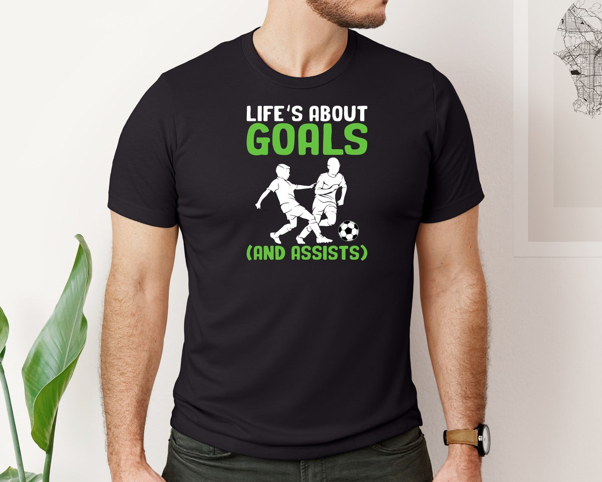 brand:Bella Canvas|color:Black|Lifes About Goals Soccer T Shirt Graphic T-Shirt
