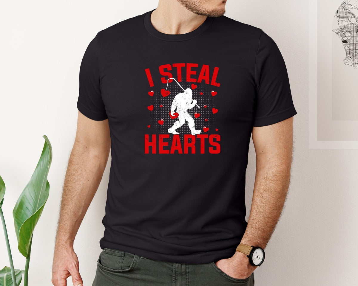 brand:Bella Canvas|color:Black|Valentines Day Bigfoot I Steal Hearts Graphic T-Shirt