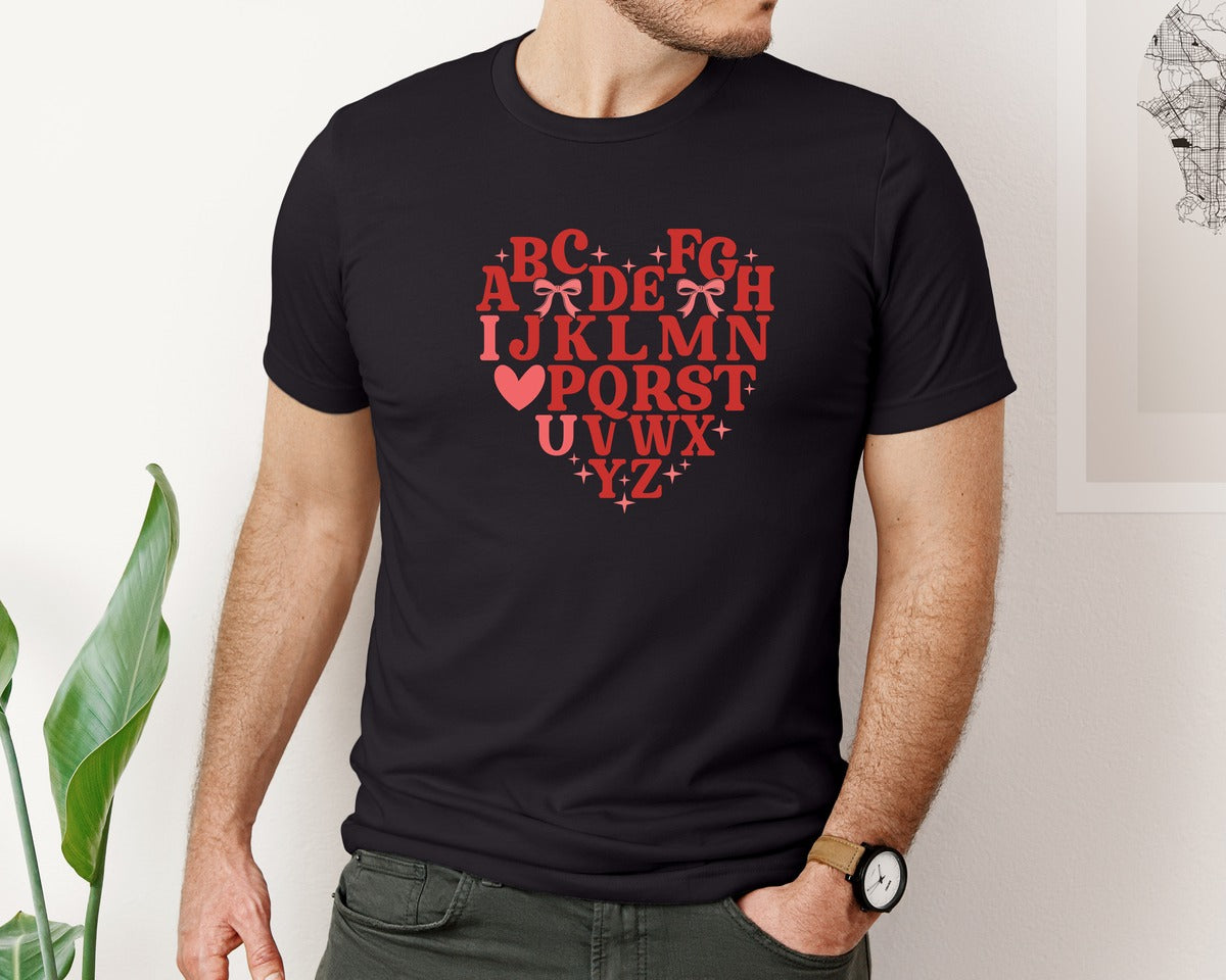 brand:Bella Canvas|color:Black|Teacher Alphabet Valentine Bow Graphic T-Shirt