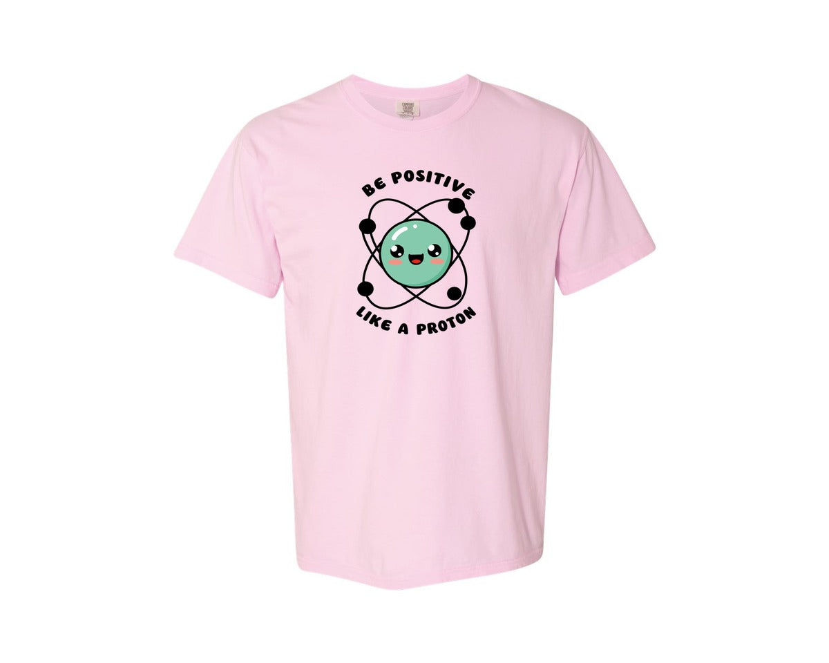 brand:Comfort Colors|color:Blossom|Be Positive Like A Proton Graphic T-Shirt