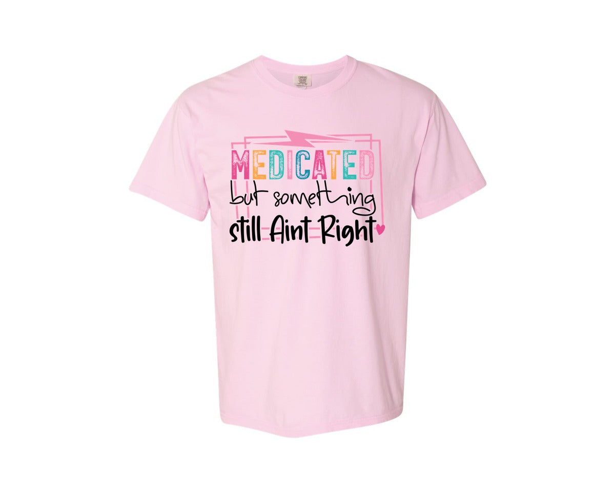 brand:Comfort Colors|color:Blossom|Medicated But Somethin Aint Right Snarky Graphic T-Shirt