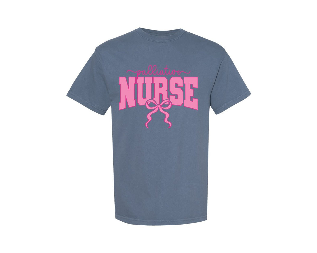 brand:Comfort Colors|color:Blue Jean|Palliative Nurse Coquette Nurse Pink Bow Graphic T-Shirt