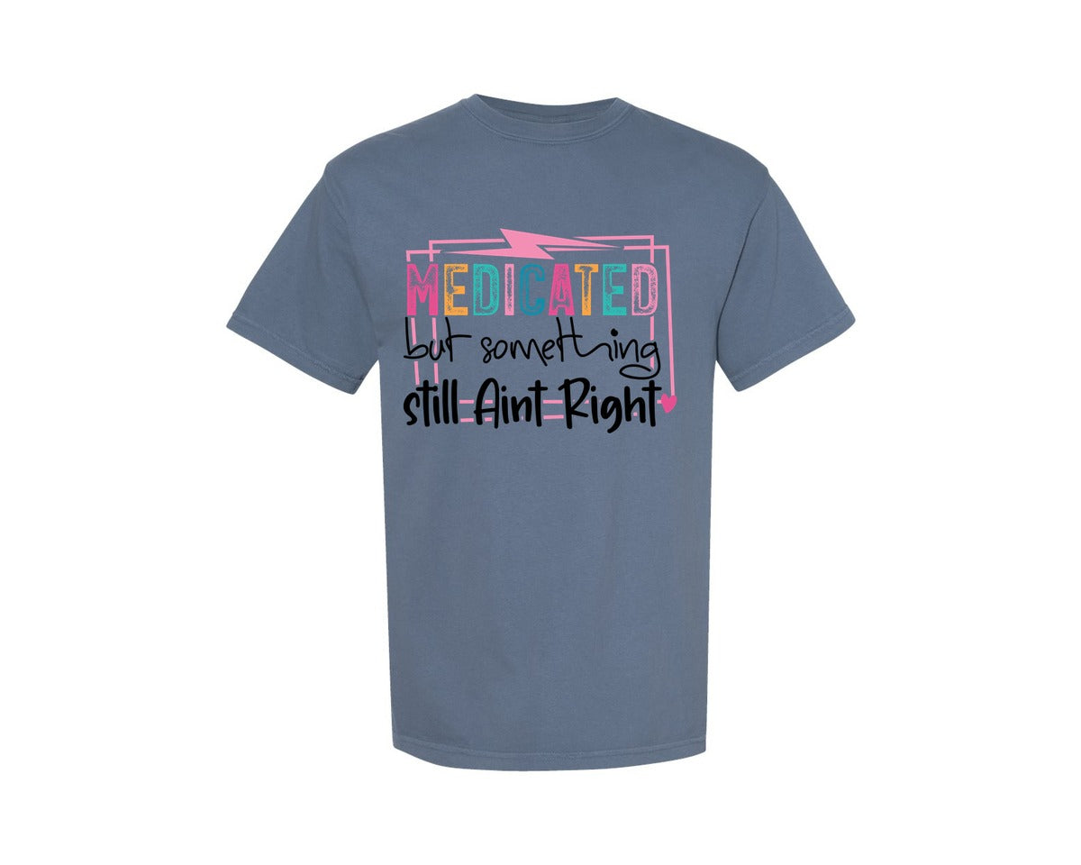 brand:Comfort Colors|color:Blue Jean|Medicated But Somethin Aint Right Snarky Graphic T-Shirt