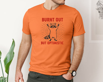 brand:Bella Canvas|color:Burnt Orange|Burnt Out But Optimistic Raccoon Graphic T-Shirt