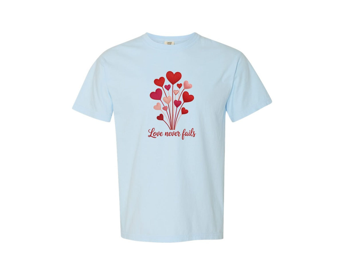 brand:Comfort Colors|color:Chambray|Yarn Heart Love Never Fails Graphic T-Shirt
