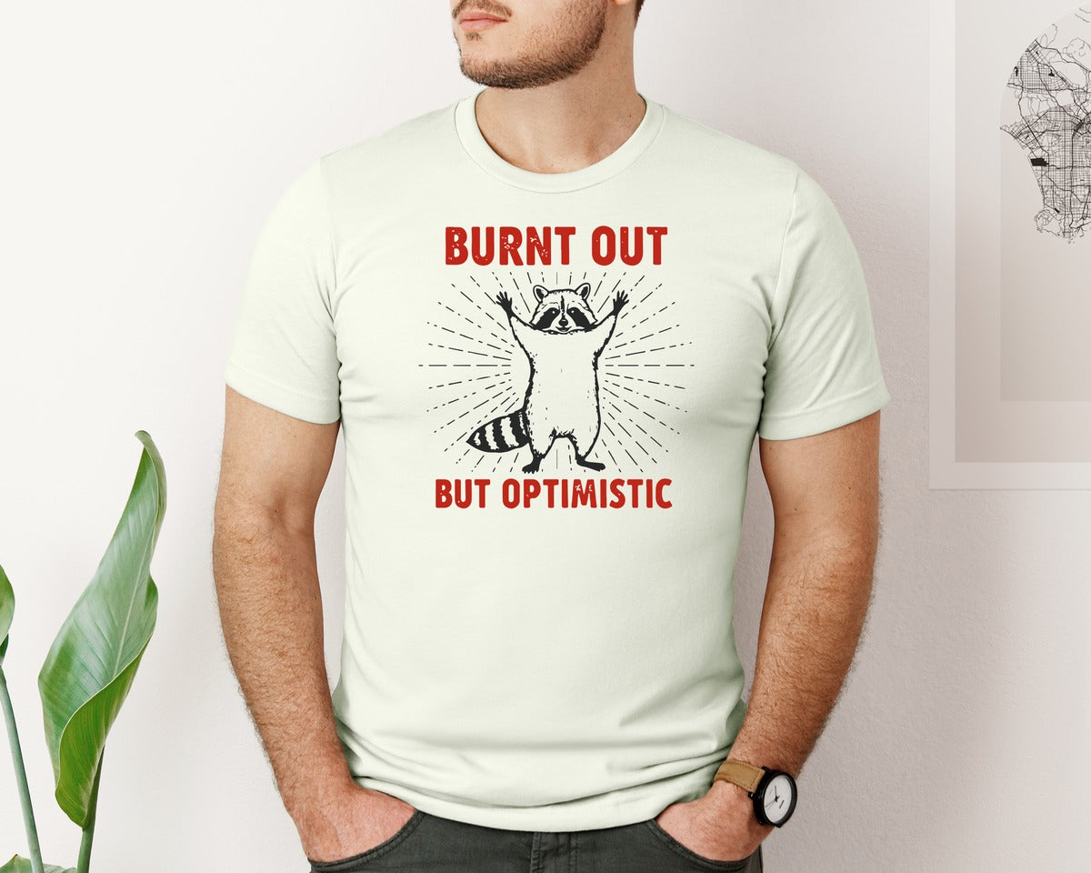 brand:Bella Canvas|color:Citron|Burnt Out But Optimistic Raccoon Graphic T-Shirt