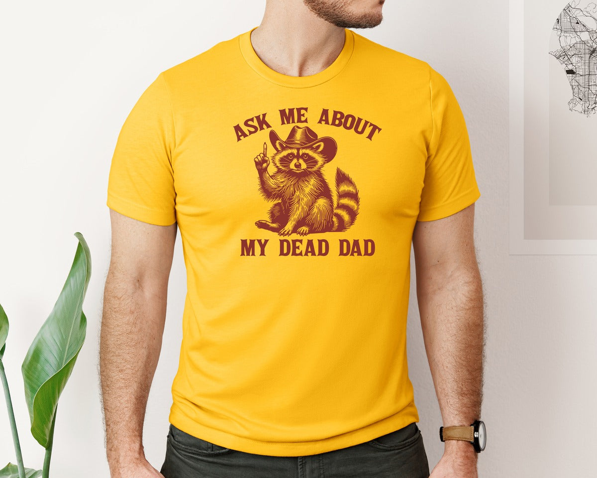 brand:Bella Canvas|color:Gold|Dead Dad Club Unhinged Meme Raccoon Graphic T-Shirt