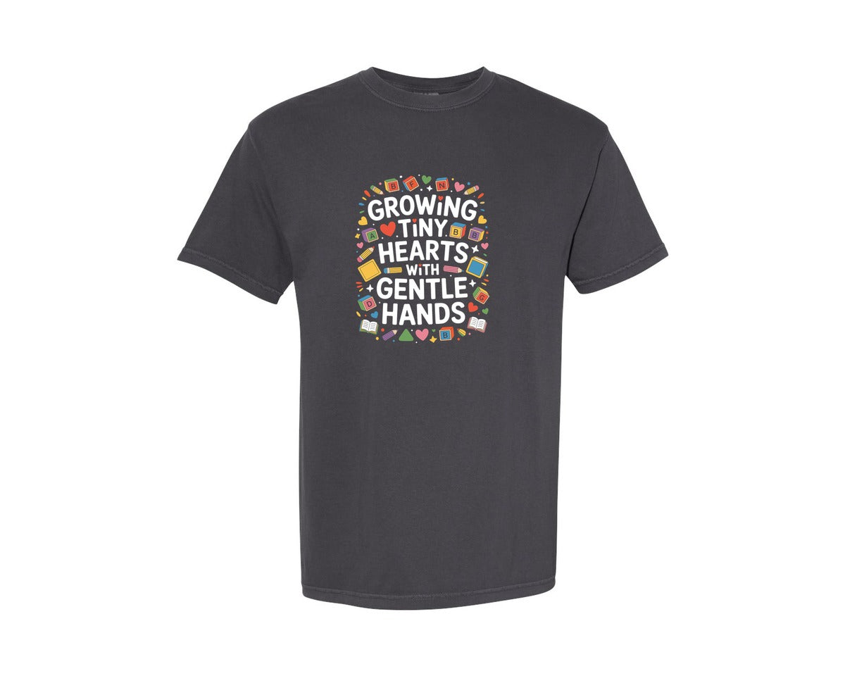 brand:Comfort Colors|color:Graphite|Growing Tiny Hearts With Gentle Hands Graphic T-Shirt