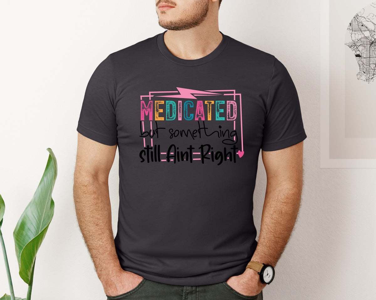 brand:Bella Canvas|color:Heather Dark Grey|Medicated But Somethin Aint Right Snarky Graphic T-Shirt