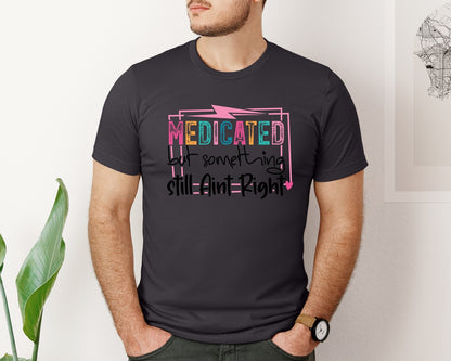 brand:Bella Canvas|color:Heather Dark Grey|Medicated But Somethin Aint Right Snarky Graphic T-Shirt