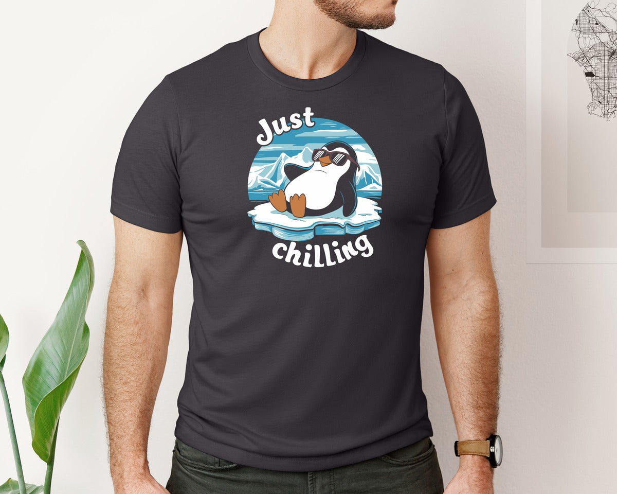 brand:Bella Canvas|color:Heather Dark Grey|Just Chilling Penguin Pun Relaxed Vibes Graphic T-Shirt