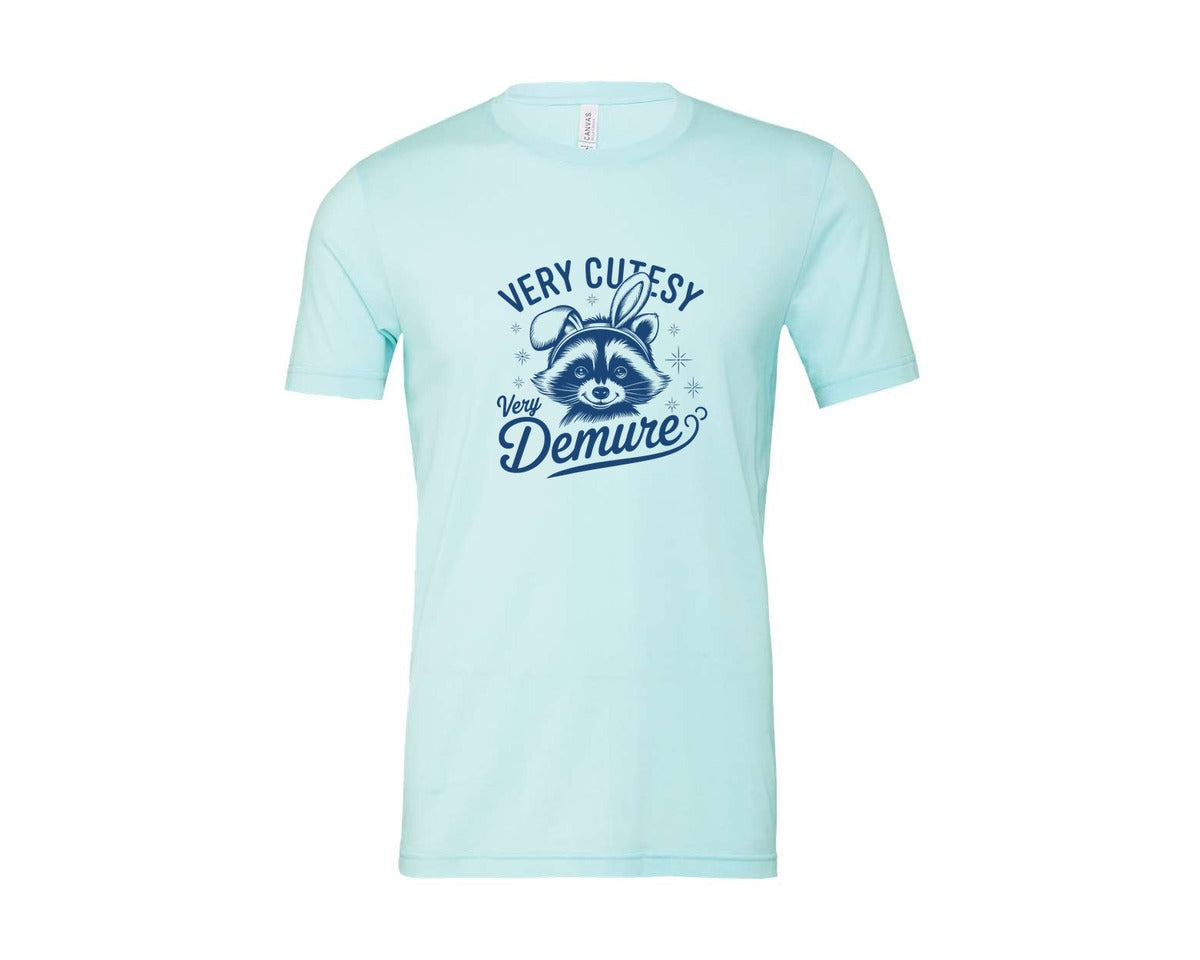 brand:Bella Canvas|color:Heather Ice Blue|Very Cutesy Very Demure Raccoon T Shirt Graphic T-Shirt
