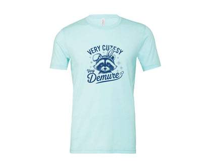 brand:Bella Canvas|color:Heather Ice Blue|Very Cutesy Very Demure Raccoon T Shirt Graphic T-Shirt