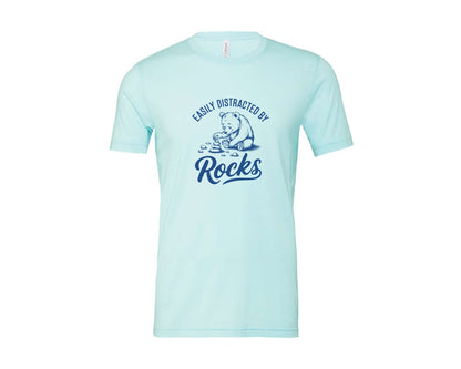 brand:Bella Canvas|color:Heather Ice Blue|Easily Distracted By Rocks Design Graphic T-Shirt