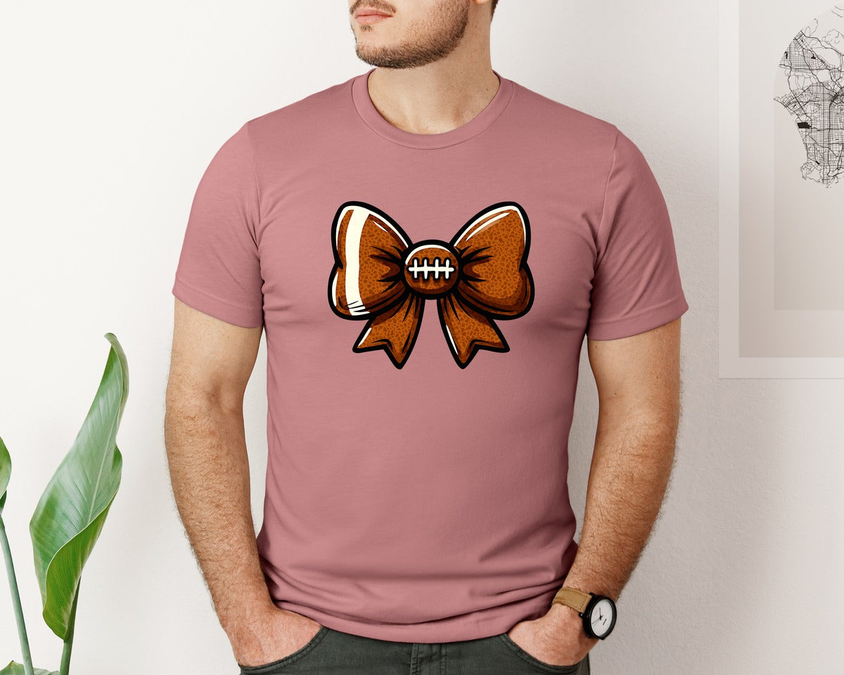 brand:Bella Canvas|color:Heather Mauve|Football Bow Sports Cheer Bow Graphic T-Shirt