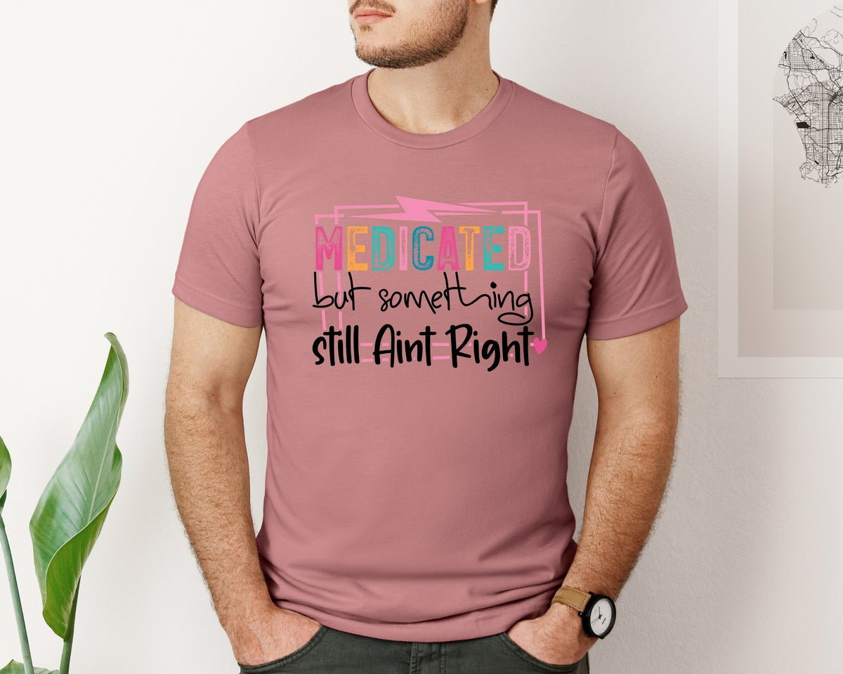 brand:Bella Canvas|color:Heather Mauve|Medicated But Somethin Aint Right Snarky Graphic T-Shirt