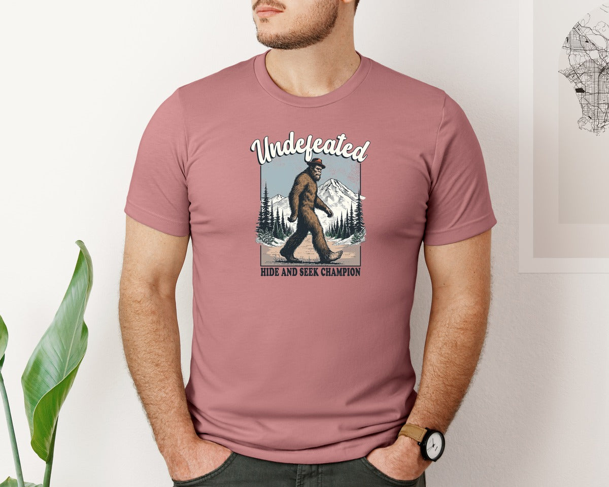 brand:Bella Canvas|color:Heather Mauve|Bigfoot Hide And Seek Champion Shirt Graphic T-Shirt