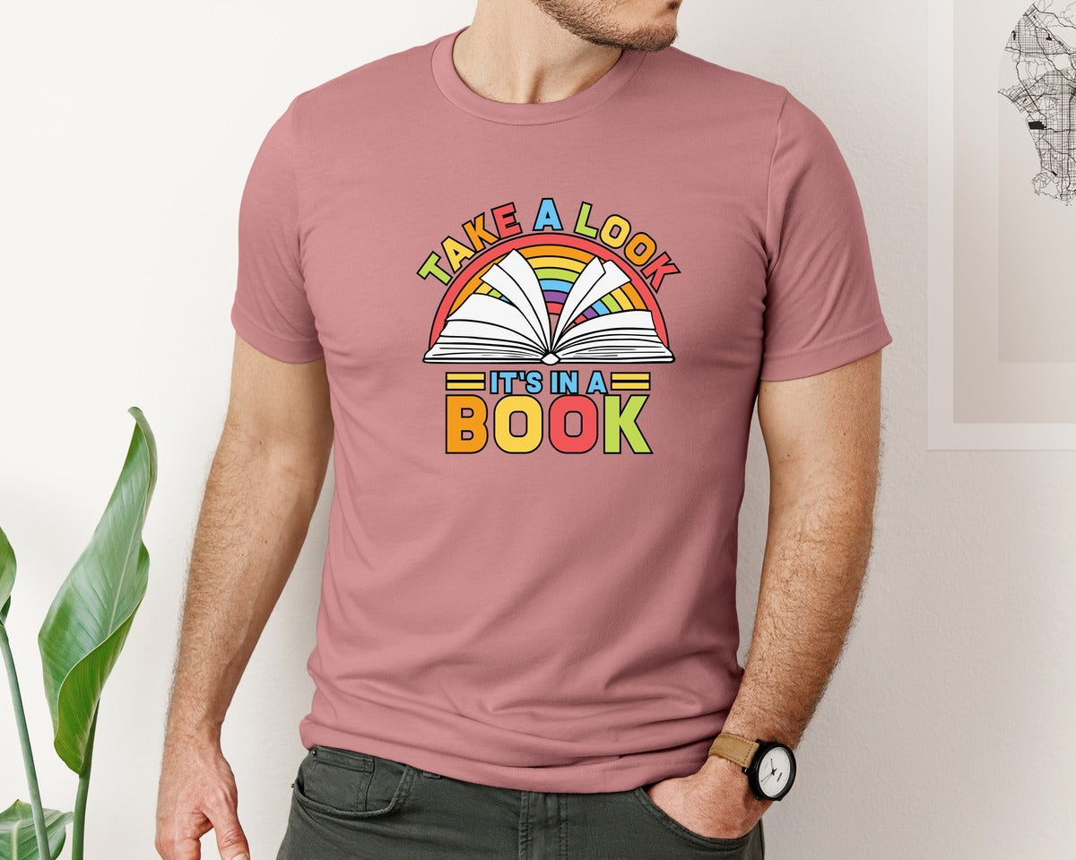 brand:Bella Canvas|color:Heather Mauve|Take A Look In A Book Rainbow Book Graphic T-Shirt