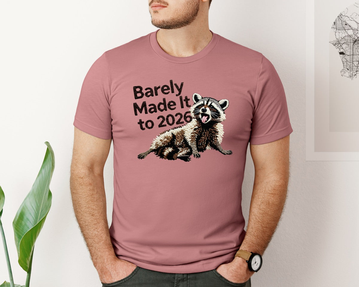 brand:Bella Canvas|color:Heather Mauve|Barely Made It To 2026 Funny Raccoon Graphic T-Shirt
