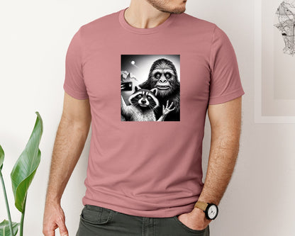 brand:Bella Canvas|color:Heather Mauve|Scarred Raccoon Selfie With Bigfoot Yeti Graphic T-Shirt
