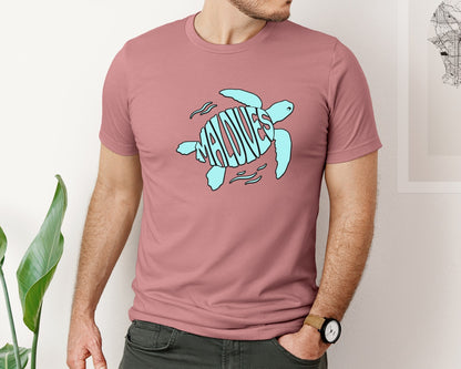 brand:Bella Canvas|color:Heather Mauve|Maldives Word Art In A Sea Turtle Shape Graphic T-Shirt
