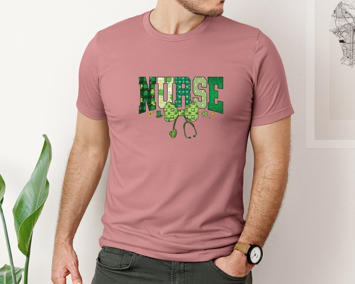brand:Bella Canvas|color:Heather Mauve|Coquette Nurse St Patricks Nurse Bow Graphic T-Shirt