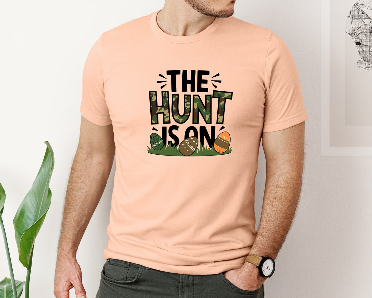 brand:Bella Canvas|color:Heather Peach|The Hunt Is On Camo Easter Egg Camo Graphic T-Shirt