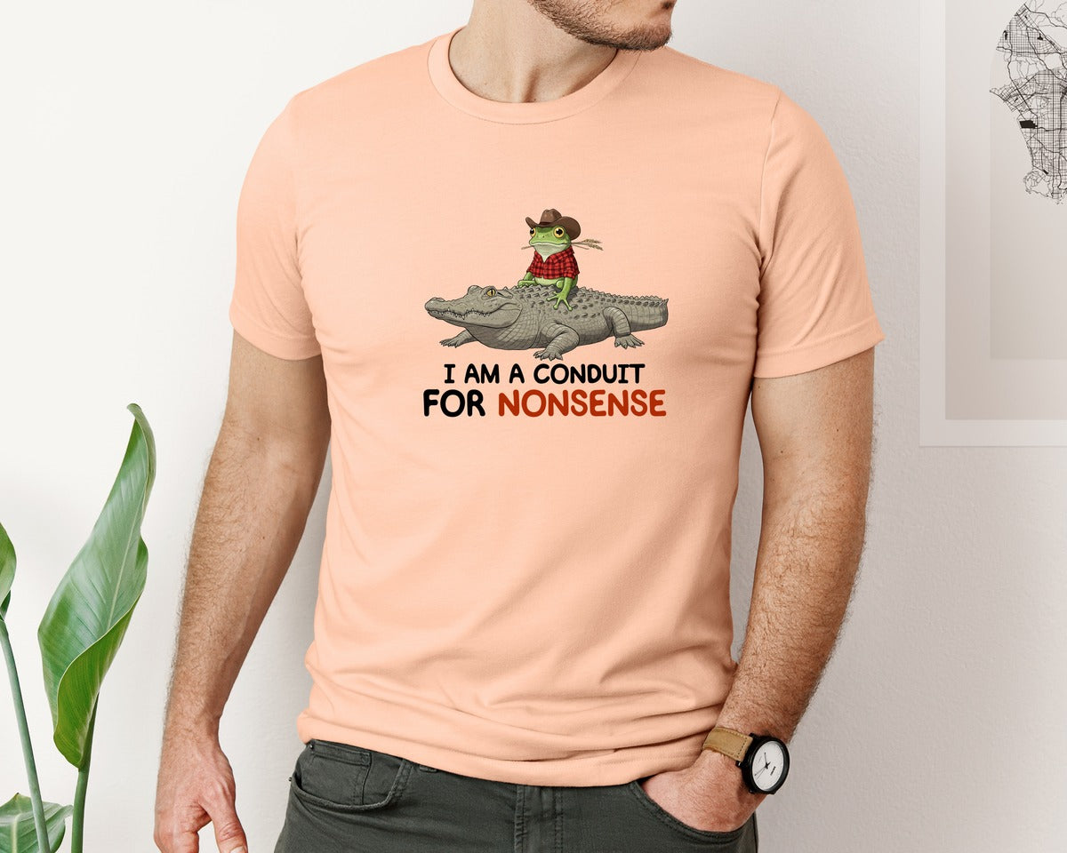 brand:Bella Canvas|color:Heather Peach|I Am A Conduit For Nonsense Frog And All Graphic T-Shirt