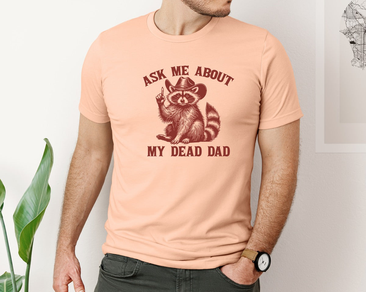 brand:Bella Canvas|color:Heather Peach|Dead Dad Club Unhinged Meme Raccoon Graphic T-Shirt