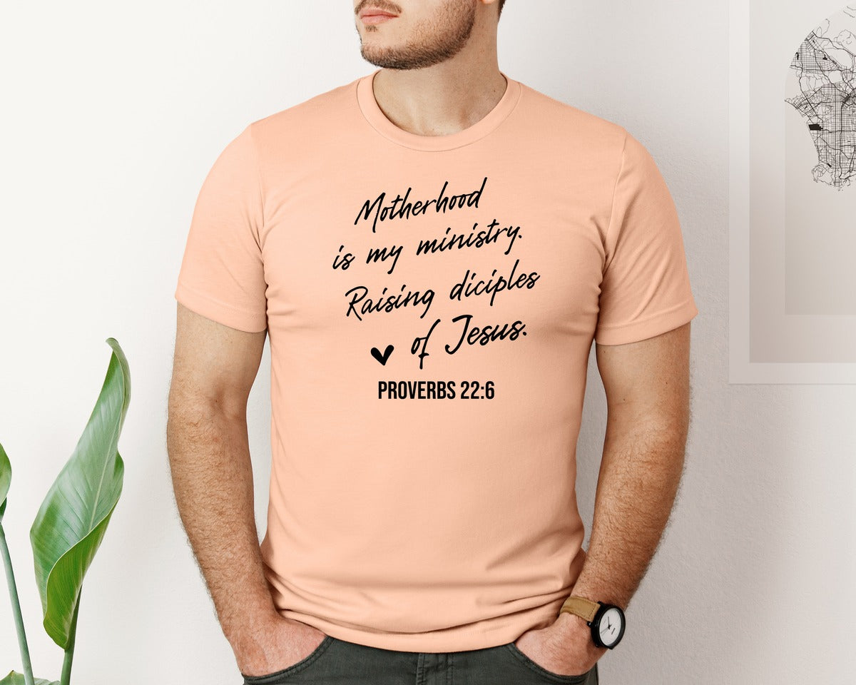 brand:Bella Canvas|color:Heather Peach|Christian Mom Motherhood Is Kingdom Graphic T-Shirt