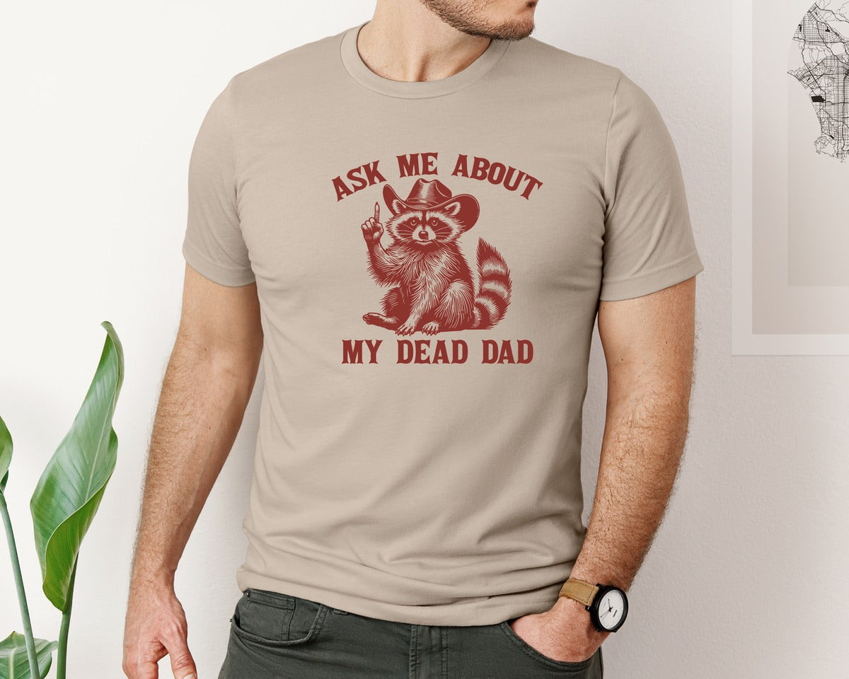 brand:Bella Canvas|color:Heather Tan|Dead Dad Club Unhinged Meme Raccoon Graphic T-Shirt