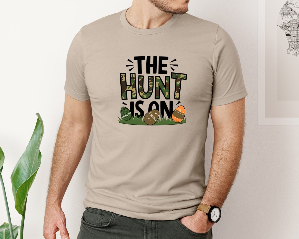 brand:Bella Canvas|color:Heather Tan|The Hunt Is On Camo Easter Egg Camo Graphic T-Shirt