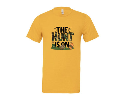 brand:Bella Canvas|color:Heather Yellow Gold|The Hunt Is On Camo Easter Egg Camo Graphic T-Shirt