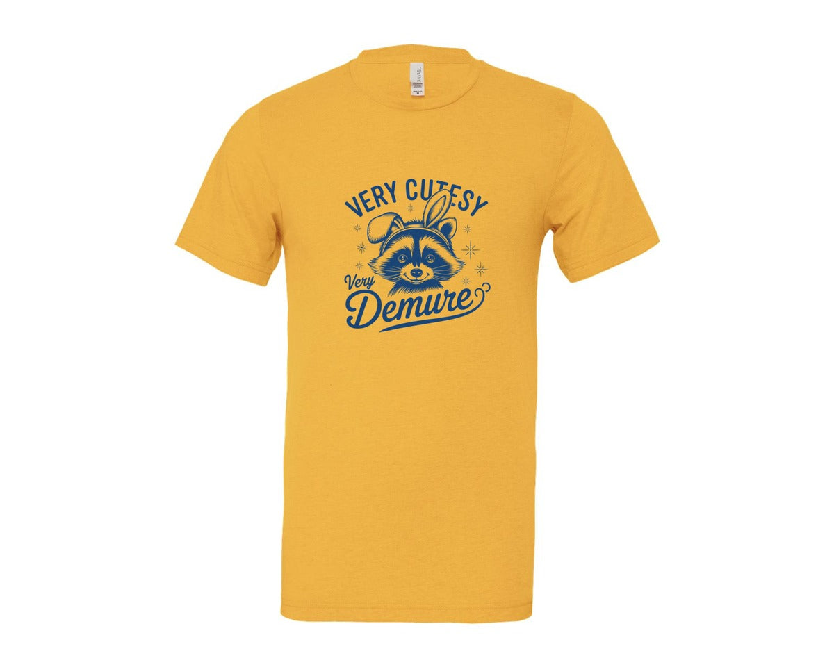 brand:Bella Canvas|color:Heather Yellow Gold|Very Cutesy Very Demure Raccoon T Shirt Graphic T-Shirt