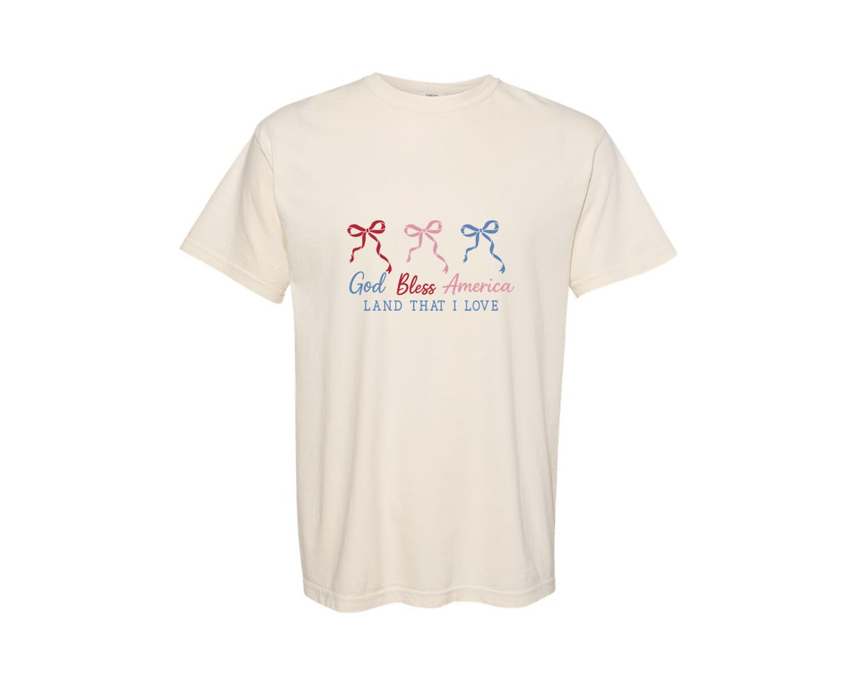 brand:Comfort Colors|color:Ivory|God Bless America Coquette Bow Patriotic Graphic T-Shirt