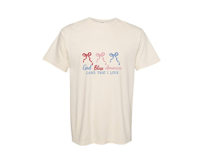 brand:Comfort Colors|color:Ivory|God Bless America Coquette Bow Patriotic Graphic T-Shirt