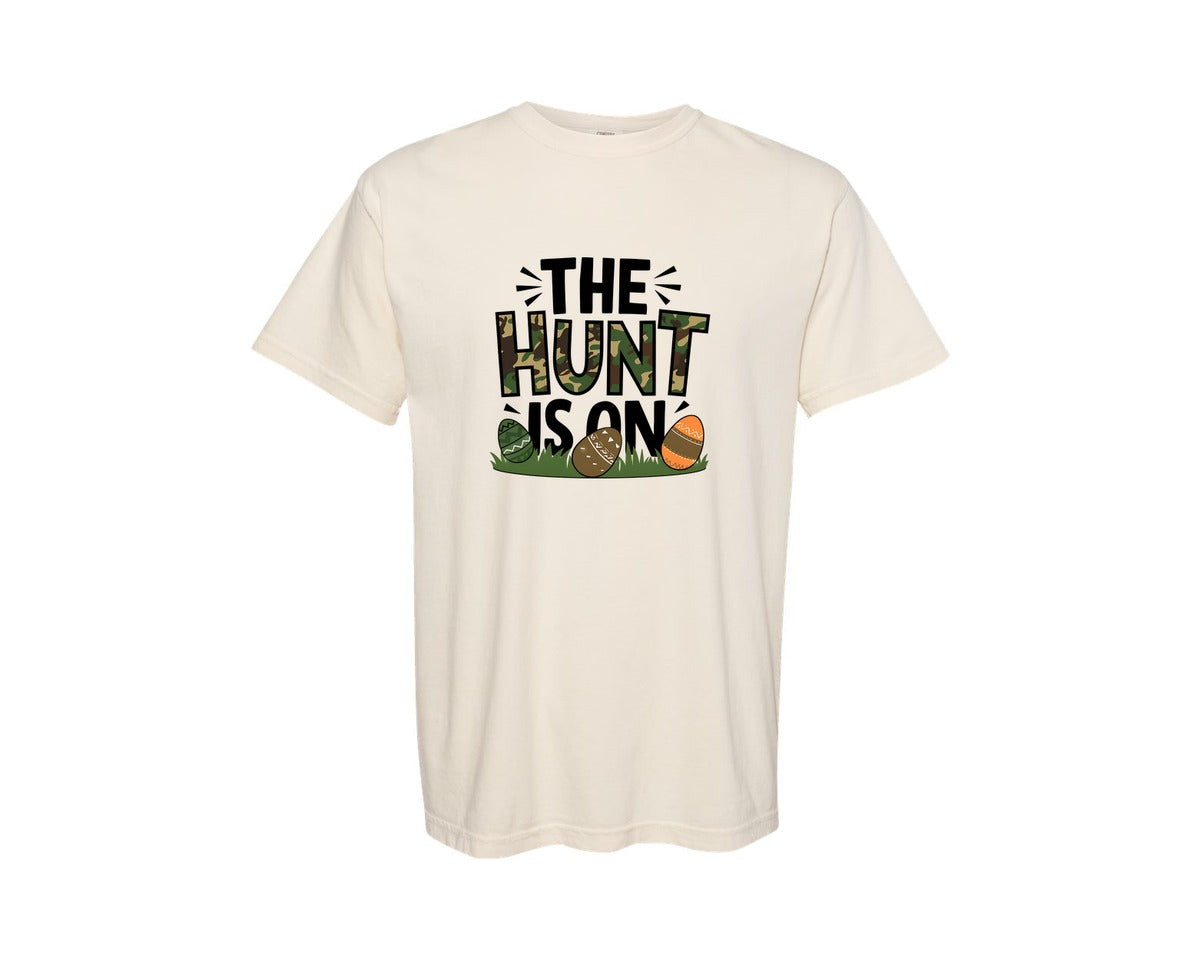 brand:Comfort Colors|color:Ivory|The Hunt Is On Camo Easter Egg Camo Graphic T-Shirt