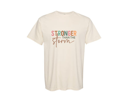 brand:Comfort Colors|color:Ivory|Stronger Than The Storm Bible Verse Graphic T-Shirt