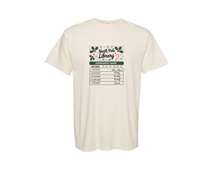 brand:Comfort Colors|color:Ivory|North Pole Library Bookish Xmas Graphic T-Shirt