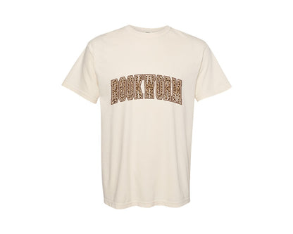 brand:Comfort Colors|color:Ivory|Leopard Bookworm Varsity Bookish Book Graphic T-Shirt