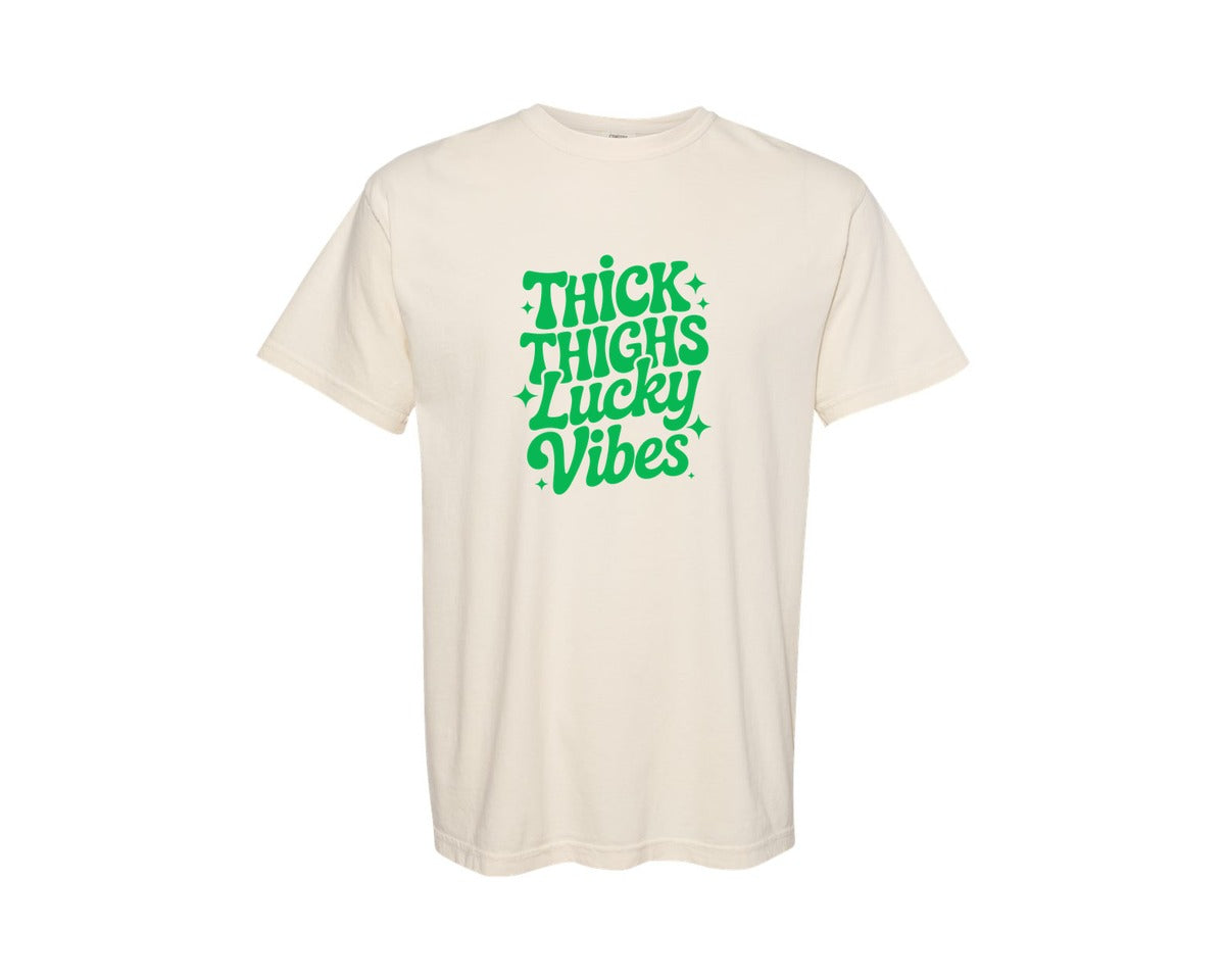 brand:Comfort Colors|color:Ivory|Thick Thighs Lucky Vibes St Patrick Graphic T-Shirt